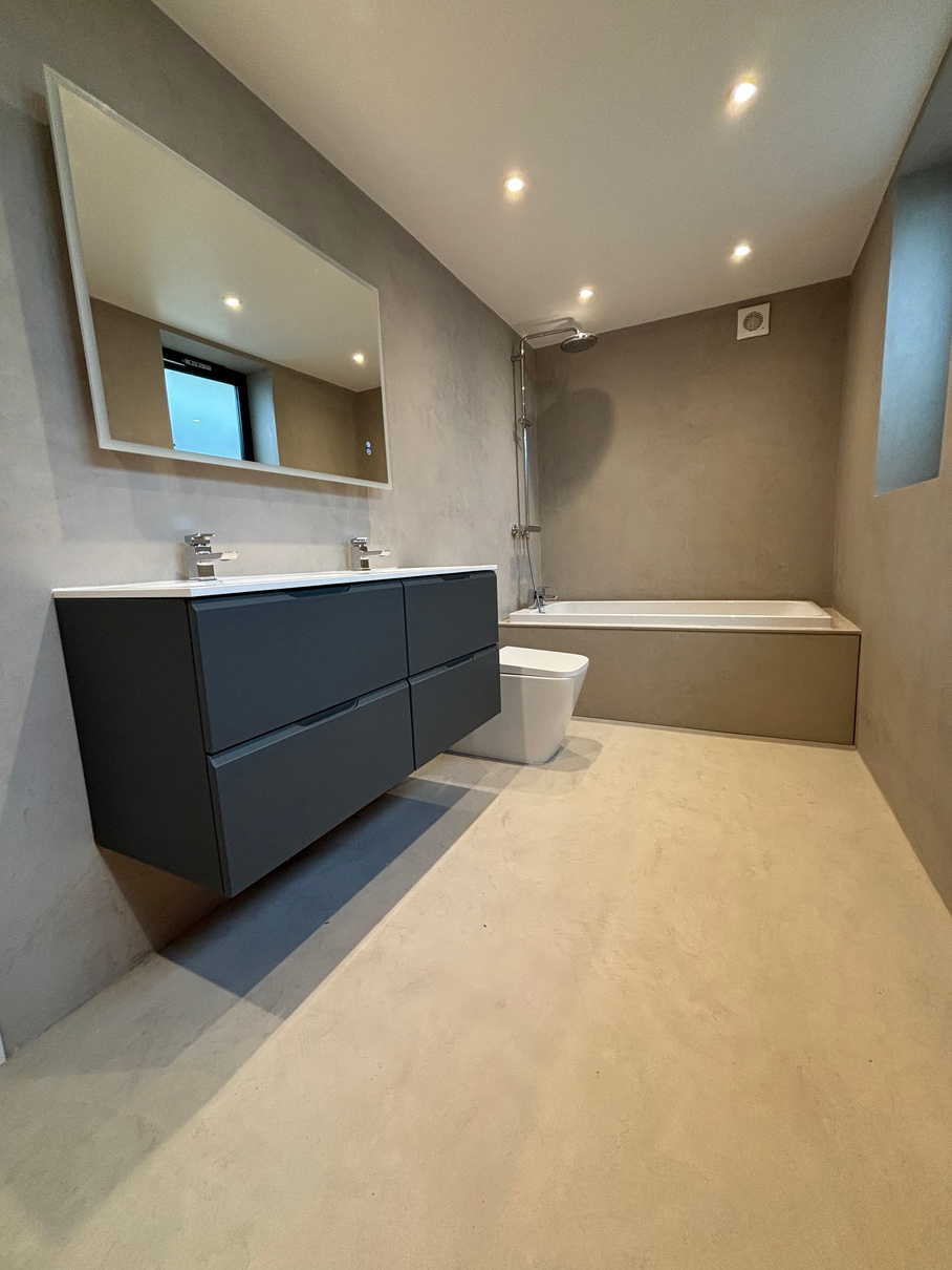 Microcement on walls and floor. Bathroom with microcement on walls and floor
