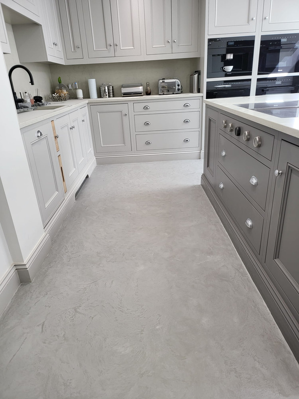 Grey concrete kitchen floor